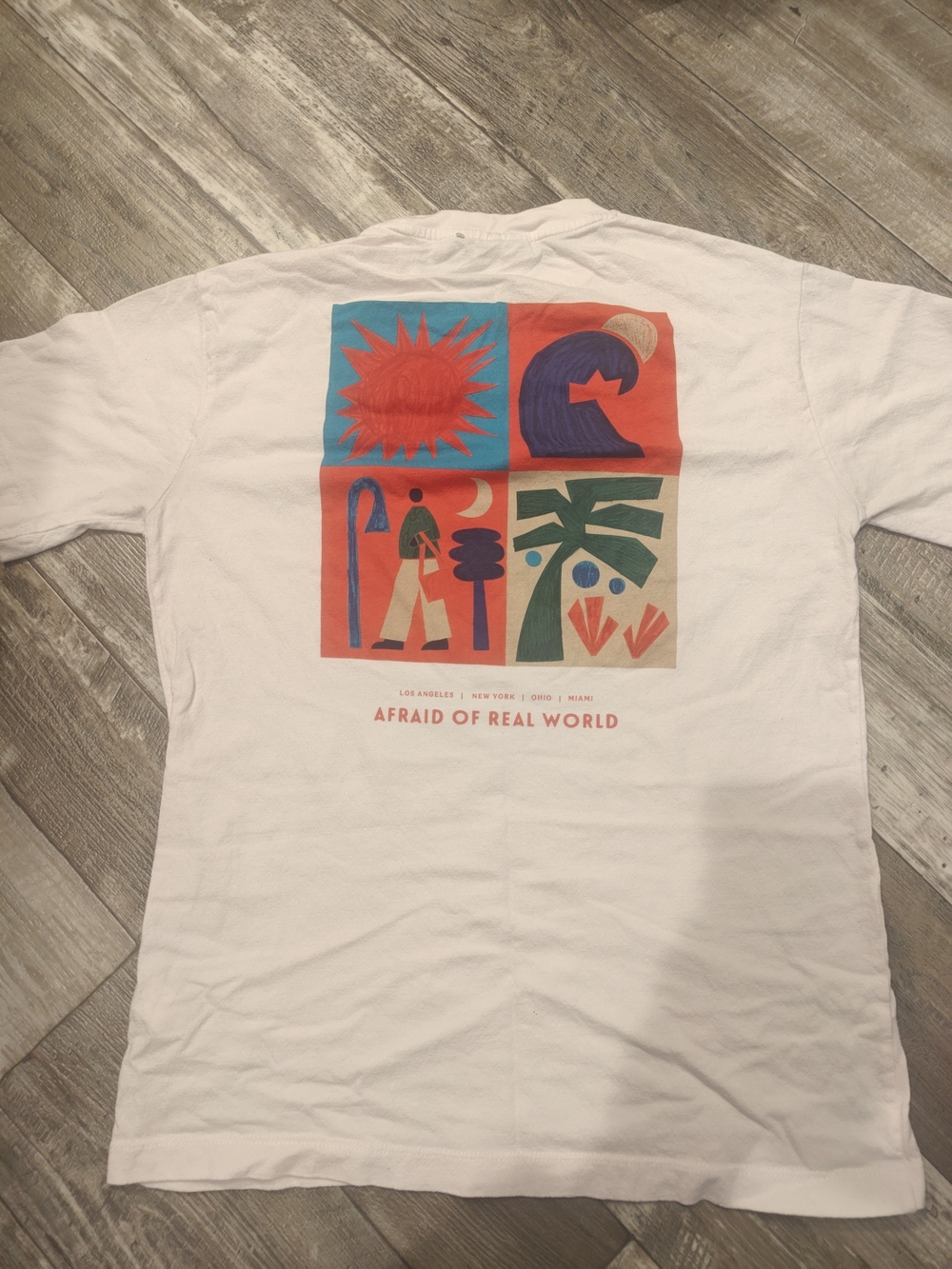 Afraid of Real World Graphic Tee - White with Red, Blue, Green